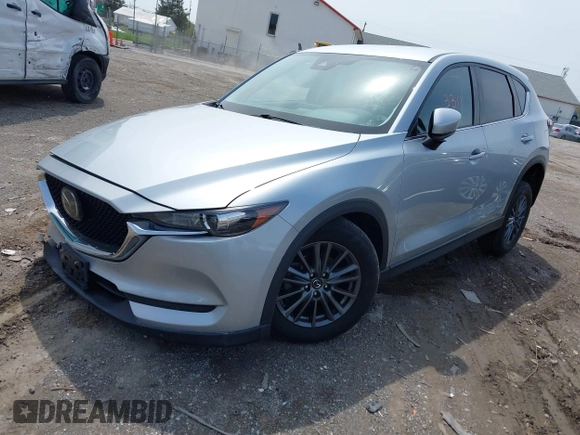 2020 Mazda CX-5 Touring with VIN JM3KFACM9L0785464, listed as a IAAI auction lot 42023311 with 90,062 mi miles and . Bid and sale history available at DreamBid. Image 17.