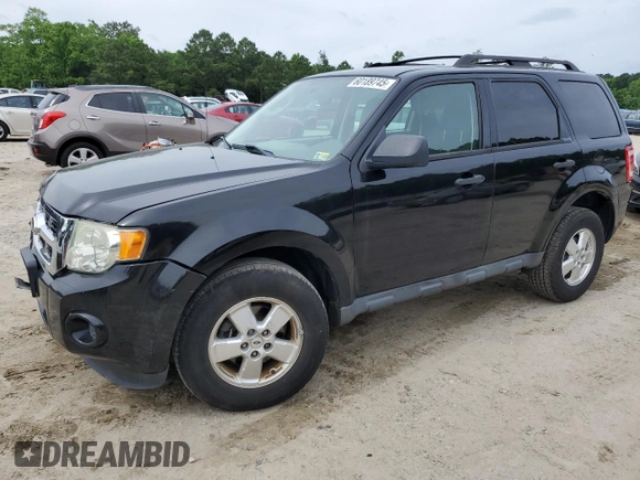 2012 Ford Escape XLS with VIN 1FMCU9C71CKA30319, listed as a Copart auction lot 60189745 with 214,736 mi miles and Salvage title. Bid and sale history available at DreamBid. Image 1.