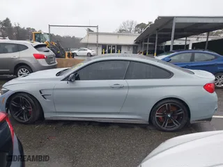2017 BMW M4 with VIN WBS3R9C53HK709173, listed as a IAAI auction lot 41978162 with 105,427 mi miles. Bid and sale history available at carsss.com. Image 14.