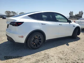 2023 Tesla Model Y Long Range z VIN 7SAYGDEE2PA061792, wystawiony jako Copart lot #52106965 z przebiegiem 11 968 mil mil oraz Szkoda całkowita • Salvage title. Historia ofert i sprzedaży dostępna na DreamBid. Obrazek 3.