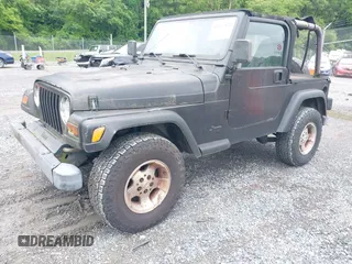 2000 Jeep Wrangler Sport z VIN 1J4FA49S1YP700545, wystawiony jako IAAI lot #42367828 z przebiegiem 214 698 mil mil oraz . Historia ofert i sprzedaży dostępna na DreamBid. Obrazek 2.