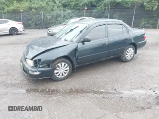 1997 Toyota Corolla with VIN 2T1BA02E2VC211034, listed as a IAAI auction lot 42253359 with 201,451 mi miles and . Bid and sale history available at DreamBid. Image 2.