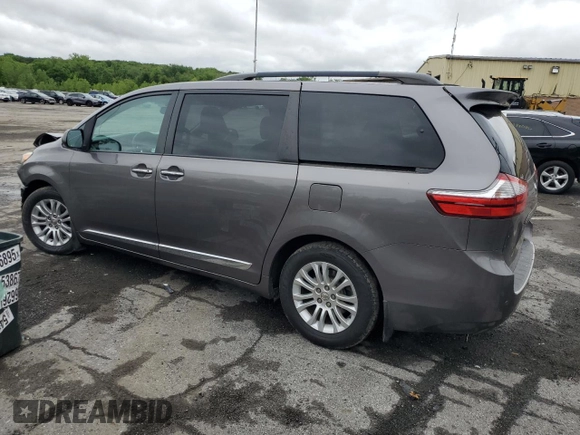 2015 Toyota Sienna XLE with VIN 5TDYK3DC4FS659692, listed as a Copart auction lot 57248355 with 121,644 mi miles and Salvage title. Bid and sale history available at DreamBid. Image 2.