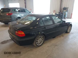 2004 BMW 3 Series 325i with VIN WBAEV334X4KL63050, listed as a IAAI auction lot 42117698 with 173,687 mi miles. Bid and sale history available at carsss.com. Image 4.