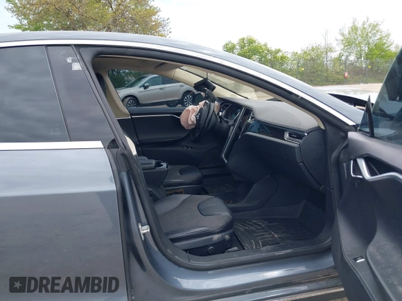 2013 Tesla Model S with VIN 5YJSA1CG9DFP27357, listed as a IAAI auction lot 42362514 with Not provided miles and . Bid and sale history available at DreamBid. Image 5.