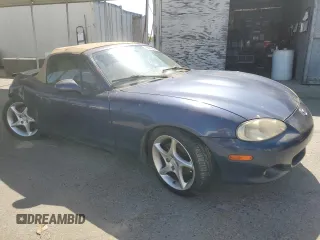 2002 Mazda MX-5 Miata Cloth z VIN JM1NB353220222868, wystawiony jako Copart lot #59944345 z przebiegiem 159 595 mil mil oraz Szkoda całkowita • Salvage title. Historia ofert i sprzedaży dostępna na DreamBid. Obrazek 4.
