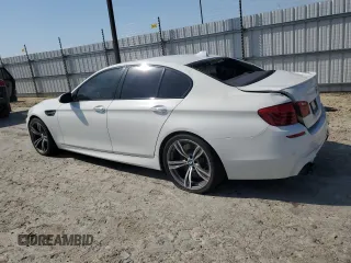 2014 BMW M5 with VIN WBSFV9C54ED097879, listed as a Copart auction lot 61380464 with 78,367 mi miles and Salvage Title. Bid and sale history available at carsss.com. Image 2.