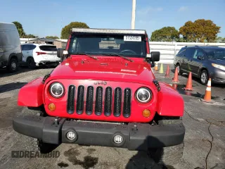 2011 Jeep Wrangler Sport with VIN 1J4AA2D17BL628066, listed as a Copart auction lot 51524285 with 105,854 mi miles and Clean Title. Bid and sale history available at carsss.com. Image 5.