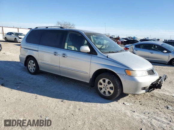 2003 Honda Odyssey EX-L with VIN 5FNRL18943B157513, listed as a Copart auction lot 47135305 with 199,079 mi miles and Salvage Title. Bid and sale history available at DreamBid. Image 4.