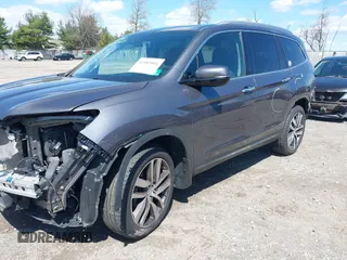 2016 Honda Pilot Elite with VIN 5FNYF6H06GB058392, listed as a IAAI auction lot 41983804 with 103,304 mi miles. Bid and sale history available at carsss.com. Image 2.