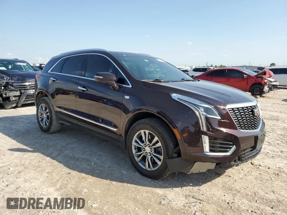 2021 Cadillac XT5 FWD Premium Luxury with VIN 1GYKNCRS2MZ180884, listed as a Copart auction lot 50433445 with 27,246 mi miles and Salvage Title. Bid and sale history available at carsss.com. Image 4.