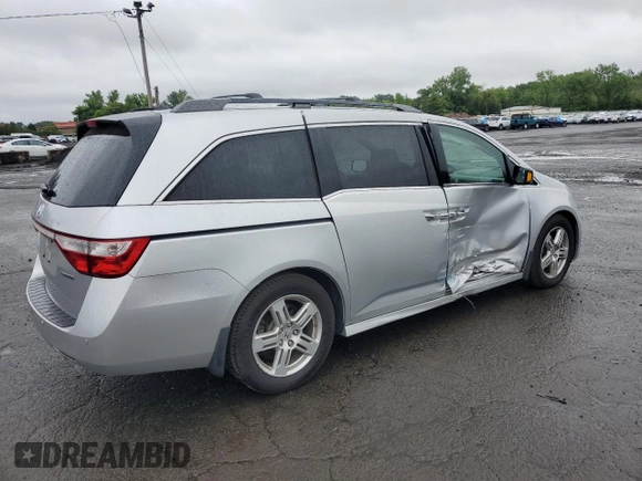 2011 Honda Odyssey Touring with VIN 5FNRL5H99BB021223, listed as a Copart auction lot 61171775 with 194,029 mi miles and Salvage title. Bid and sale history available at DreamBid. Image 3.