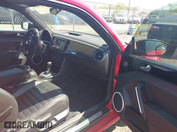 2012 Volkswagen Beetle 2.0T Turbo w/Sun/Snd/Nav PZEV with VIN 3VWVA7AT4CM608798, listed as a IAAI auction lot 42130353 with 152,052 mi miles. Bid and sale history available at carsss.com. Image 5.