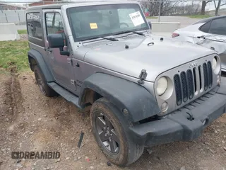 2014 Jeep Wrangler Sport z VIN 1C4AJWAG2EL209228, wystawiony jako IAAI lot #41834285 z przebiegiem 194 331 mil mil oraz . Historia ofert i sprzedaży dostępna na DreamBid. Obrazek 1.