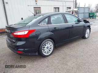 2014 Ford Focus Titanium with VIN 1FADP3J25EL310199, listed as a IAAI auction lot 40682901 with 84,885 mi miles and . Bid and sale history available at DreamBid. Image 4.