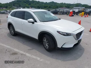 2019 Mazda CX-9 Touring with VIN JM3TCACY1K0334804, listed as a IAAI auction lot 42411662 with 49,447 mi miles and . Bid and sale history available at DreamBid. Image 1.