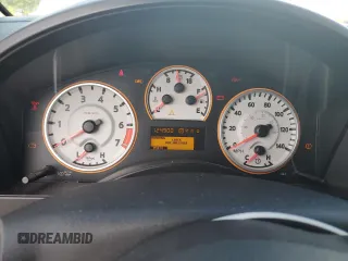 2012 Nissan Titan SV z VIN 1N6BA0EC2CN309207, wystawiony jako Copart lot #60451435 z przebiegiem 124 900 mil mil oraz Szkoda całkowita • Salvage title. Historia ofert i sprzedaży dostępna na DreamBid. Obrazek 9.