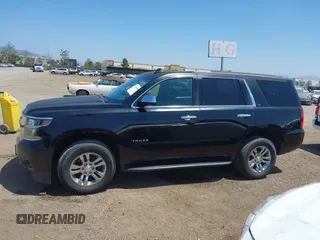 2015 Chevrolet Tahoe LT with VIN 1GNSCBKC8FR612607, listed as a IAAI auction lot 42099907 with 138,037 mi miles and . Bid and sale history available at DreamBid. Image 14.