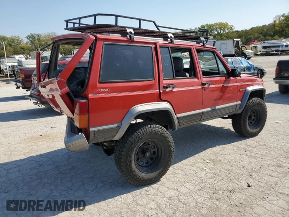 1996 Jeep Cherokee Country with VIN 1J4FJ78S9TL130605, listed as a Copart auction lot 74673934 with 196,857 mi miles and Salvage Title. Bid and sale history available at carsss.com. Image 3.