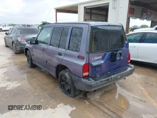 1996 Geo Tracker z VIN 2CNBE1361T6901708, wystawiony jako IAAI lot #41998005 z przebiegiem 223 266 mil mil oraz . Historia ofert i sprzedaży dostępna na DreamBid. Obrazek 3.