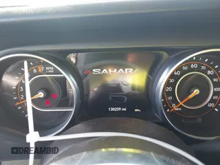 2018 Jeep Wrangler Unlimited Sahara z VIN 1C4HJXEG9JW227829, wystawiony jako IAAI lot #42099356 z przebiegiem 130 259 mil mil oraz . Historia ofert i sprzedaży dostępna na DreamBid. Obrazek 7.