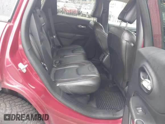 2015 Jeep Cherokee Trailhawk with VIN 1C4PJMBSXFW667469, listed as a IAAI auction lot 42438006 with 127,136 mi miles and . Bid and sale history available at DreamBid. Image 8.