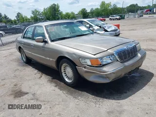 2001 Mercury Grand Marquis LS z VIN 2MEFM75W31X704182, wystawiony jako IAAI lot #42086175 z przebiegiem 177 892 mil mil oraz . Historia ofert i sprzedaży dostępna na DreamBid. Obrazek 1.