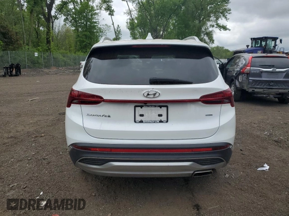 2022 Hyundai Santa Fe SEL z VIN 5NMS6DAJ0NH428003, wystawiony jako Copart lot #57133475 z przebiegiem 23 015 mil mil oraz Szkoda całkowita • Salvage title. Historia ofert i sprzedaży dostępna na DreamBid. Obrazek 6.