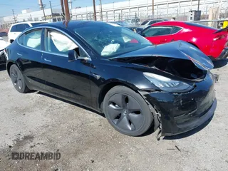 2018 Tesla Model 3 Long Range Battery with VIN 5YJ3E1EB9JF183920, listed as a IAAI auction lot 41657742 with 107,358 mi miles and . Bid and sale history available at DreamBid. Image 1.