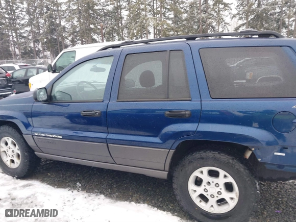 2001 Jeep Grand Cherokee Laredo with VIN 1J4GW48N21C730703, listed as a IAAI auction lot 41581667 with 111,054 mi miles. Bid and sale history available at carsss.com. Image 15.