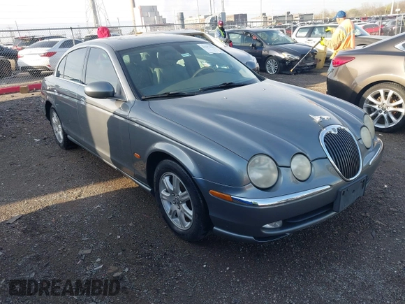 2003 Jaguar S-Type with VIN SAJEA01T23FM93839, listed as a IAAI auction lot 41891973 with 153,761 mi miles and . Bid and sale history available at DreamBid. Image 1.
