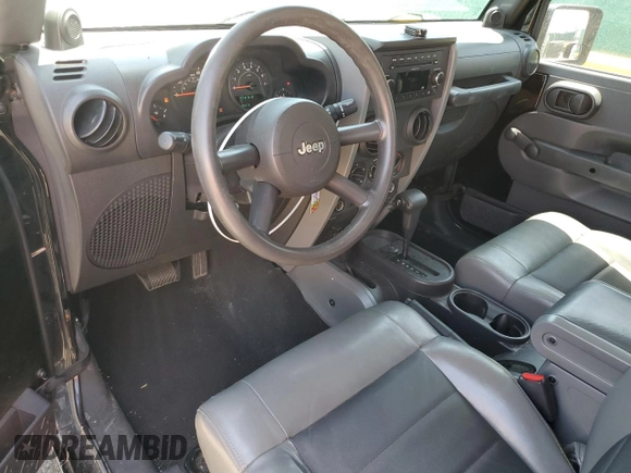 2009 Jeep Wrangler X z VIN 1J4FA24179L716499, wystawiony jako Copart lot #58342675 z przebiegiem 116 871 mil mil oraz Szkoda całkowita • Salvage title. Historia ofert i sprzedaży dostępna na DreamBid. Obrazek 8.