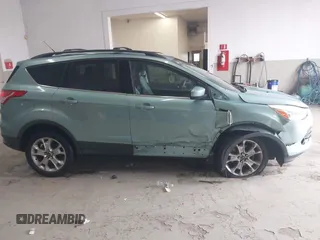 2013 Ford Escape SE with VIN 1FMCU0GX6DUC09872, listed as a IAAI auction lot 42020093 with 215,906 mi miles and . Bid and sale history available at DreamBid. Image 14.