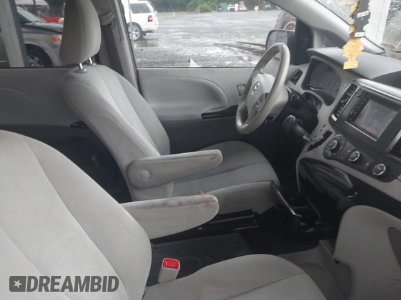 2014 Toyota Sienna L with VIN 5TDZK3DC9ES473780, listed as a IAAI auction lot 42245274 with 203,060 mi miles and . Bid and sale history available at DreamBid. Image 5.