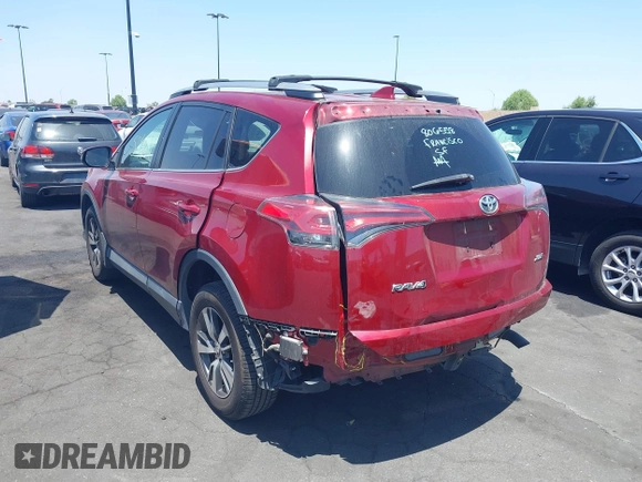 2018 Toyota RAV4 XLE with VIN 2T3WFREV4JW505053, listed as a IAAI auction lot 42552459 with 94,552 mi miles and . Bid and sale history available at DreamBid. Image 3.