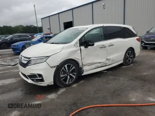2018 Honda Odyssey Elite with VIN 5FNRL6H98JB033383, listed as a Copart auction lot 51976345 with 105,556 mi miles and Salvage title. Bid and sale history available at DreamBid. Image 1.