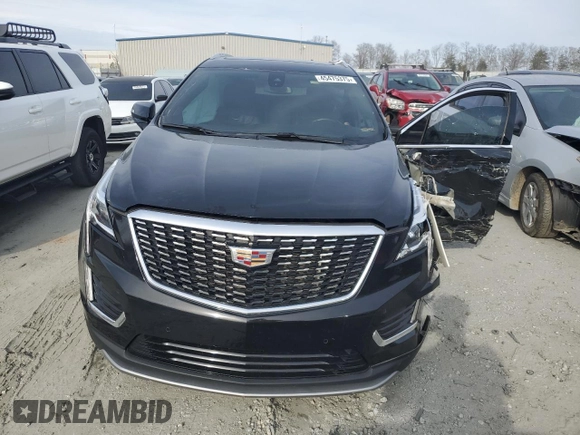 2023 Cadillac XT5 FWD Premium Luxury z VIN 1GYKNCRS6PZ145494, wystawiony jako Copart lot #45475375 z przebiegiem 48 339 mil mil oraz Szkoda całkowita • Salvage title. Historia ofert i sprzedaży dostępna na DreamBid. Obrazek 5.