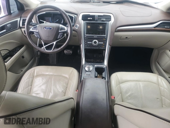 2017 Ford Fusion Titanium z VIN 3FA6P0SUXHR268559, wystawiony jako Copart lot #57456085 z przebiegiem 124 072 mil mil oraz Szkoda całkowita • Salvage title. Historia ofert i sprzedaży dostępna na DreamBid. Obrazek 8.