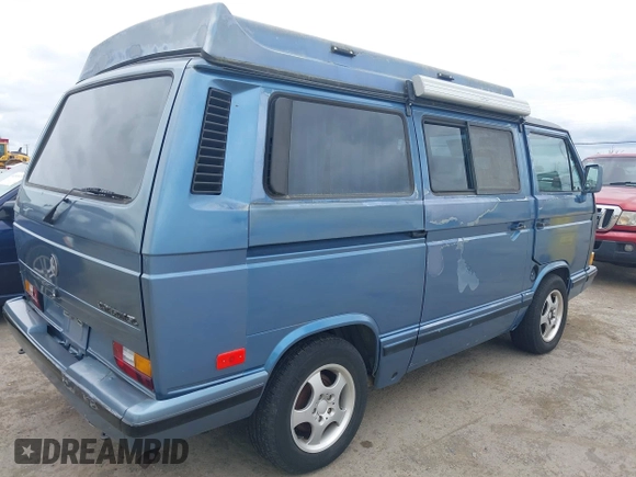 1989 Volkswagen Vanagon with VIN WV2YB0252KH059286, listed as a IAAI auction lot 42137080 with 130,604 mi miles and . Bid and sale history available at DreamBid. Image 4.