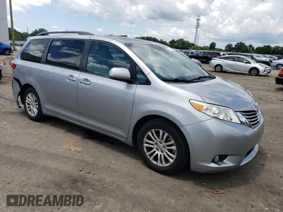 2015 Toyota Sienna XLE with VIN 5TDYK3DC0FS592251, listed as a Copart auction lot 60126165 with 118,925 mi miles and Salvage title. Bid and sale history available at DreamBid. Image 4.