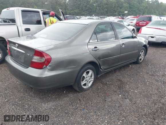 2004 Toyota Camry LE with VIN 4T1BE30K24U921028, listed as a IAAI auction lot 42187174 with 295,174 mi miles and . Bid and sale history available at DreamBid. Image 4.