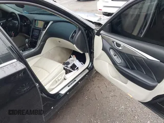 2014 Infiniti Q50 Premium z VIN JN1BV7AR2EM705630, wystawiony jako IAAI lot #42258650 z przebiegiem 109 151 mil mil oraz . Historia ofert i sprzedaży dostępna na DreamBid. Obrazek 5.