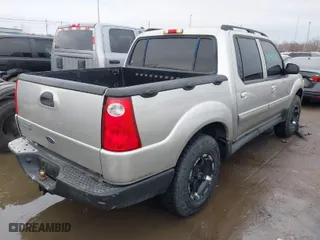 2003 Ford Explorer Sport Trac XLS with VIN 1FMZU77E63UC31712, listed as a IAAI auction lot 41645392 with 250,381 mi miles. Bid and sale history available at carsss.com. Image 4.