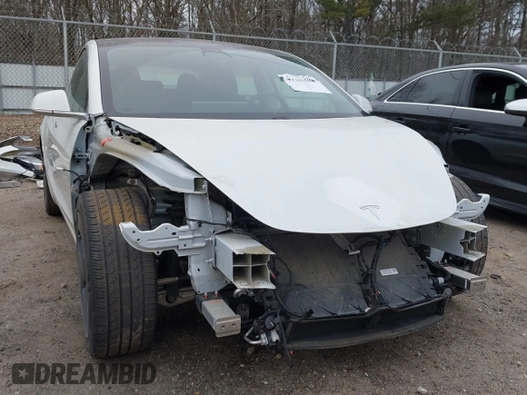 2020 Tesla Model 3 Standard Range Plus with VIN 5YJ3E1EA1LF799766, listed as a IAAI auction lot 41386508 with 90,000 mi miles. Bid and sale history available at carsss.com. Image 6.