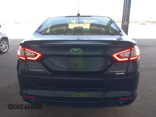 2014 Ford Fusion Titanium with VIN 3FA6P0K97ER328482, listed as a IAAI auction lot 40252350 with 137,128 mi miles. Bid and sale history available at carsss.com. Image 16.