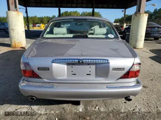 2000 Jaguar XJ VDP with VIN SAJDA24C2YLF03686, listed as a Copart auction lot 77023654 with 215,569 mi miles and Salvage Title. Bid and sale history available at carsss.com. Image 6.