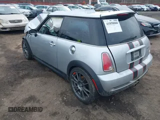 2006 MINI Hardtop S with VIN WMWRE33546TL23876, listed as a IAAI auction lot 41858060 with 146,359 mi miles and . Bid and sale history available at DreamBid. Image 3.