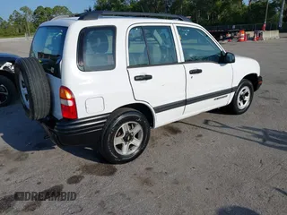 2001 Chevrolet Tracker z VIN 2CNBE13C916939402, wystawiony jako IAAI lot #42232082 z przebiegiem 103 693 mil mil oraz . Historia ofert i sprzedaży dostępna na DreamBid. Obrazek 4.