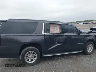 2015 GMC Yukon XL SLE z VIN 1GKS1GKC8FR507436, wystawiony jako IAAI lot #42113696 z przebiegiem Nie podano mil oraz . Historia ofert i sprzedaży dostępna na DreamBid. Obrazek 13.
