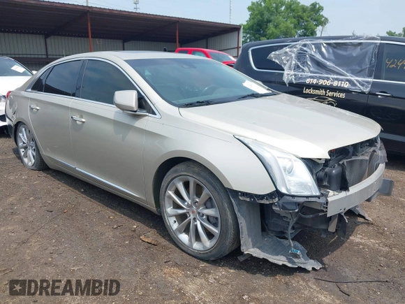 2014 Cadillac XTS Luxury z VIN 2G61M5S38E9291182, wystawiony jako IAAI lot #42495838 z przebiegiem 104 941 mil mil oraz . Historia ofert i sprzedaży dostępna na DreamBid. Obrazek 1.